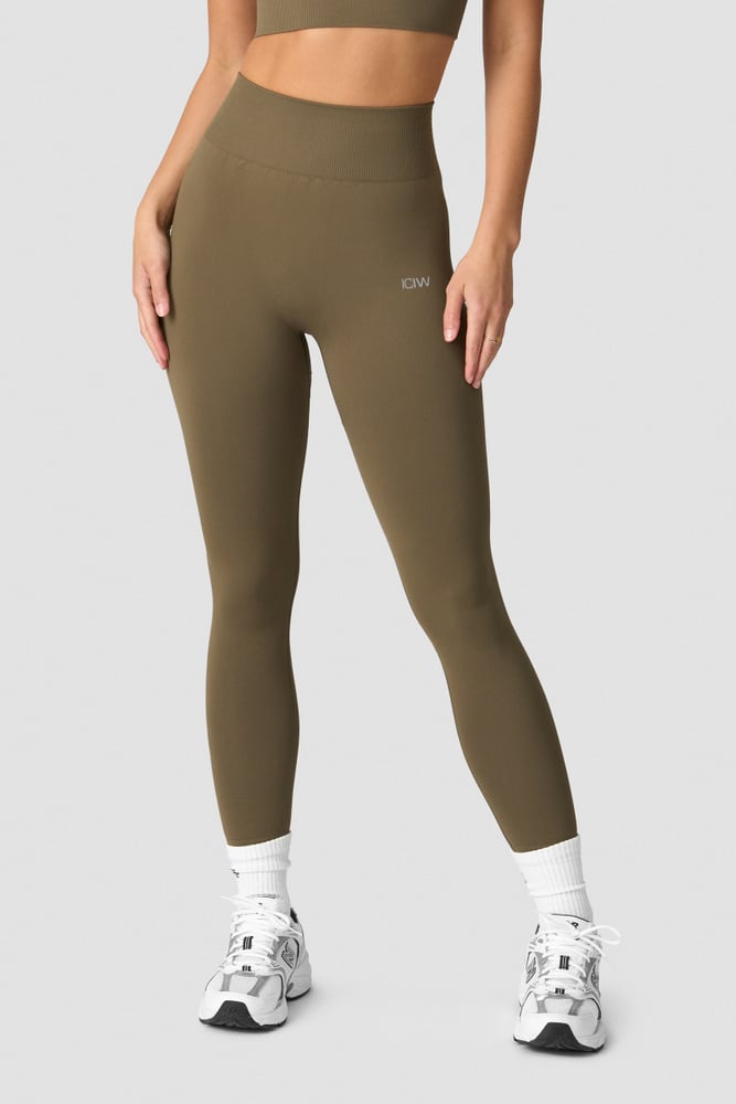 define seamless tights dark sand